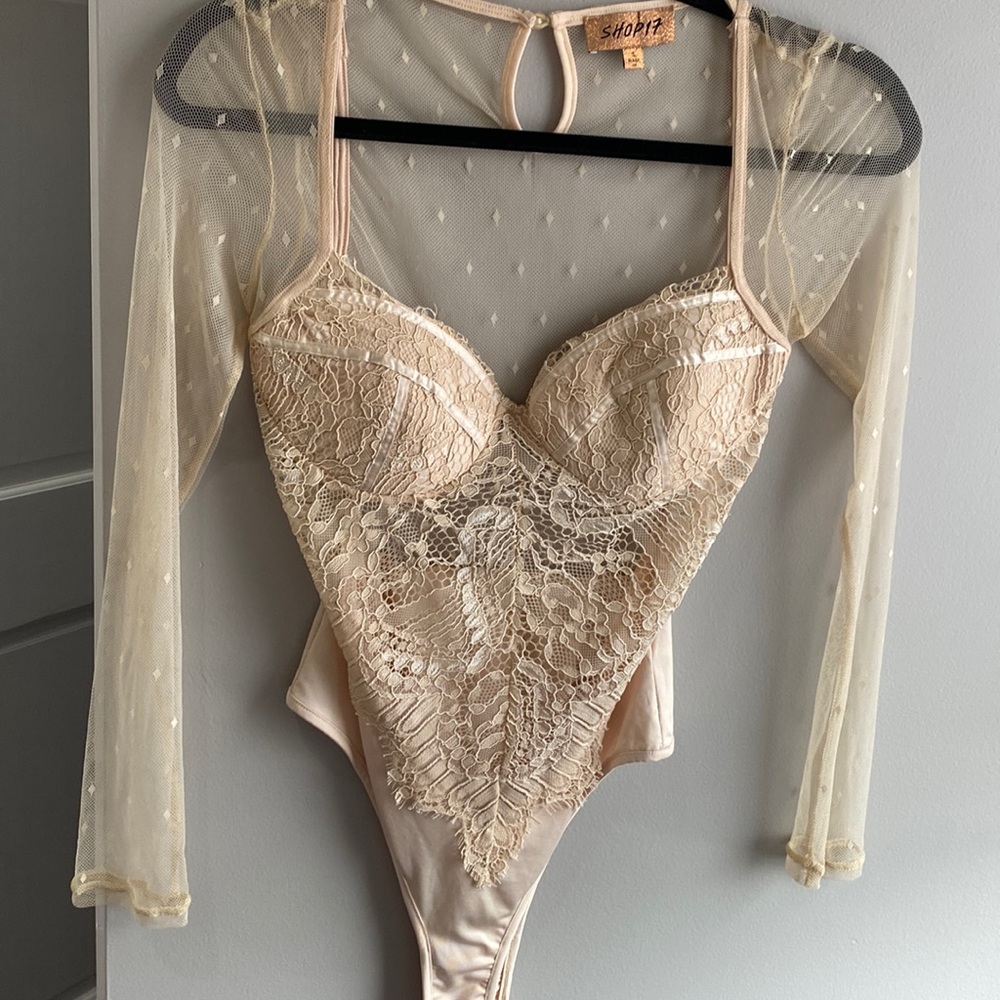 Nude lace body suit